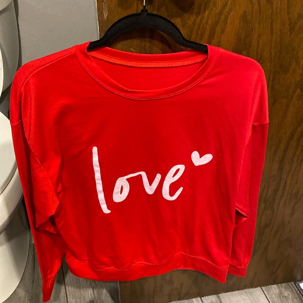 Red long sleeved graphic tshirt in brand new condition. Worn one time only